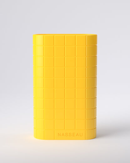 Yellow 3d printed oval vase with 'Nasseau' branding on a light gray background