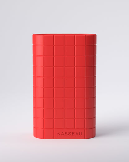Red 3d printed oval vase with 'Nasseau' branding on a light gray background