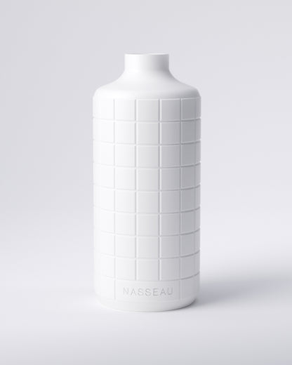 White 3d printed round vase with 'Nasseau' branding on a light gray background
