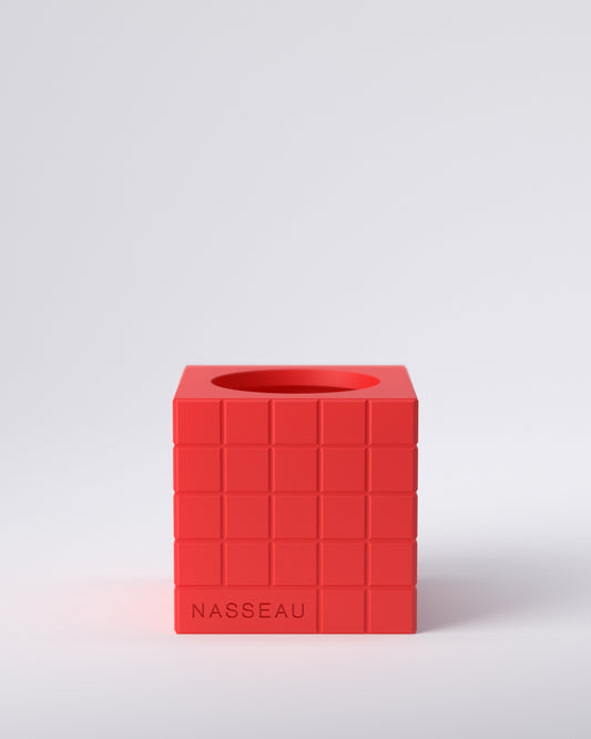 Red 3d printed square vase with 'Nasseau' branding on a light gray background